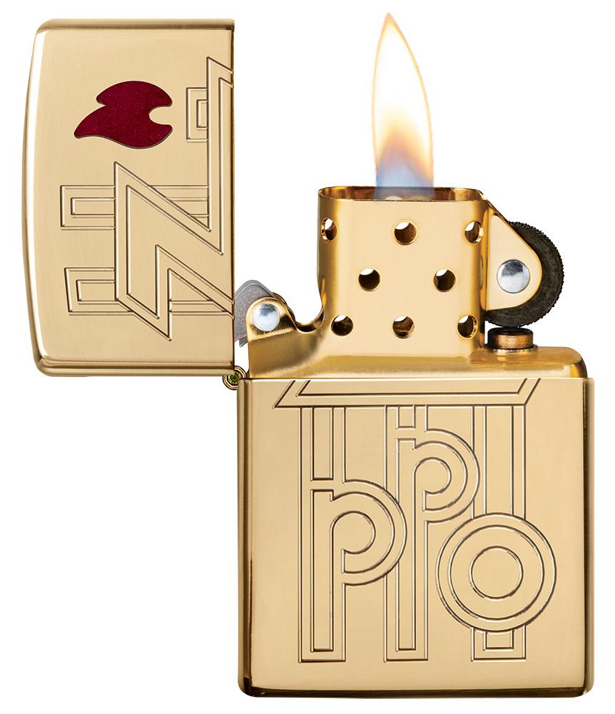 Armor® High Polished Brass Abstract Zippo Logo Windproof Lighter with its lid open and lit