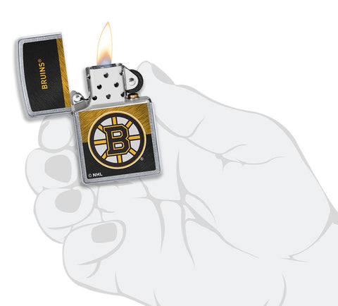 NHL® Boston Bruins Street Chrome™ Windproof Lighter lit in hand