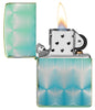 Pattern Design High Polish Teal Windproof Lighter with its lid open and lit.