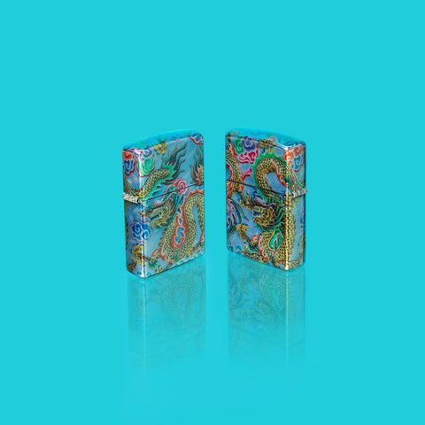 Glamour Shot of two Zippo Dragon Design 540 Fusion Windproof Lighters standing in a blue scene.