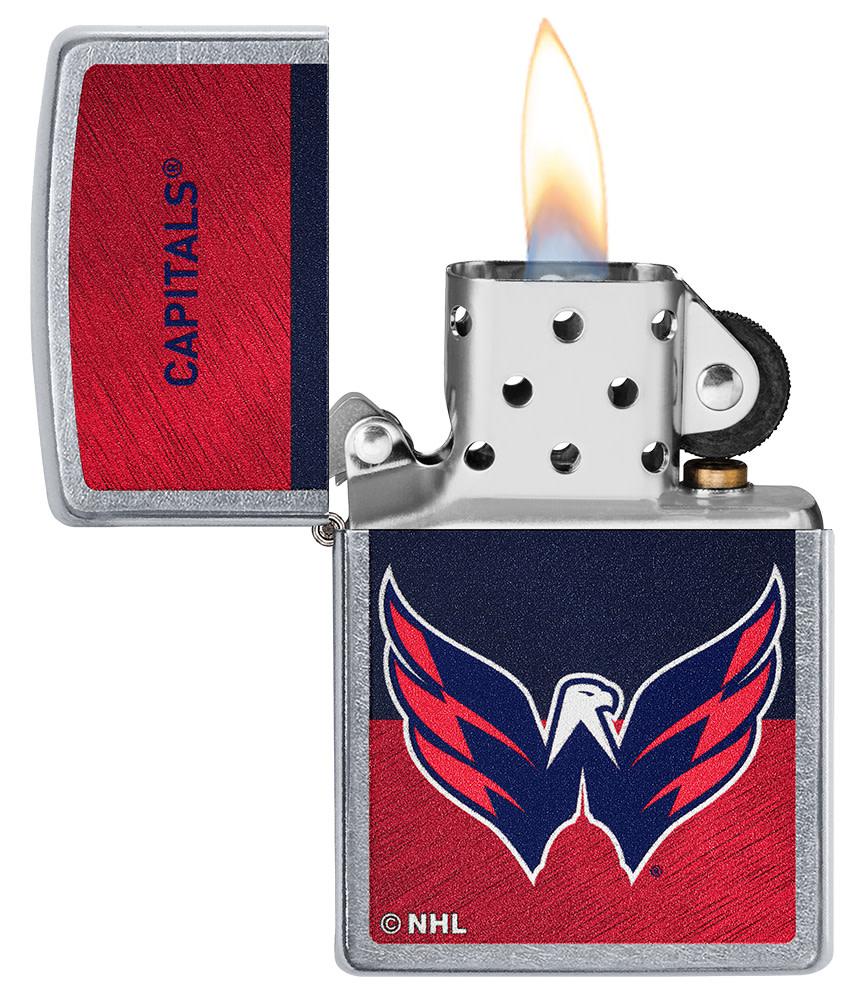NHL® Washington Capitals Street Chrome™ Windproof Lighter with its lid open and lit