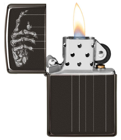 Skeleton Puppet Strings High Polish Black Windproof Lighter with its lid open and lit
