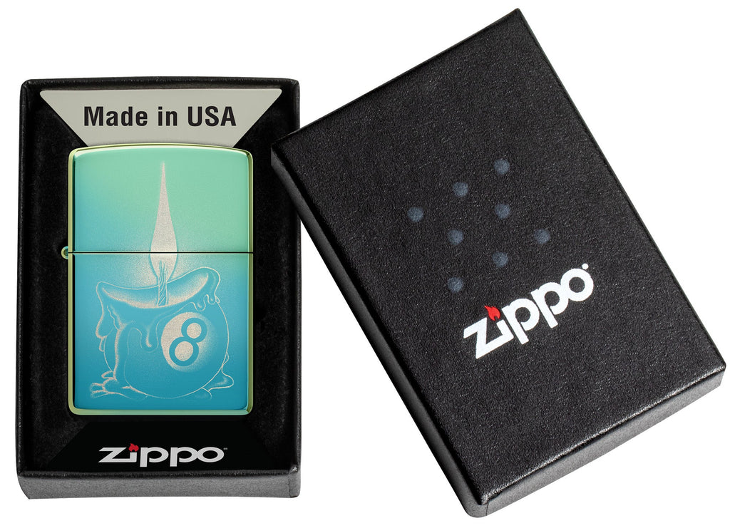 Zippo Eight Ball Tattoo Design High Polish Teal Windproof Lighter in its packaging.