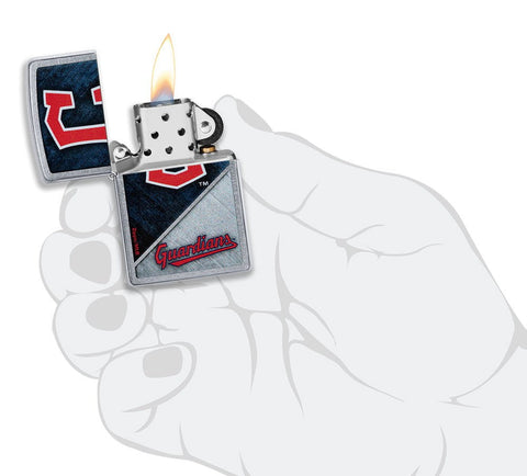 MLB® Cleveland Guardians™ Street Chrome™ Windproof Lighter lit in hand.