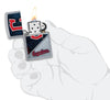 MLB™ Cleveland Guardians™ Street Chrome™ Windproof Lighter lit in hand.