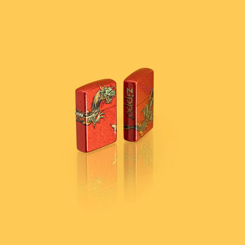 Lifestyle image of two Zippo Dragon Design 540 Fusion Windproof Lighters standing in a yellow scene,