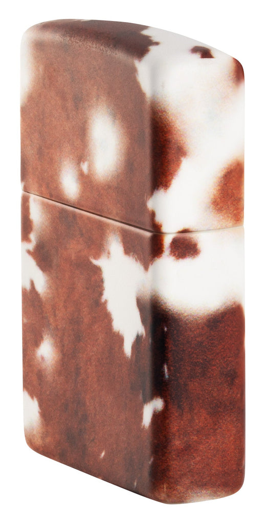 Angled shot of Cow Print Design 540 Color Windproof Lighter, showing the front and right side of the lighter.
