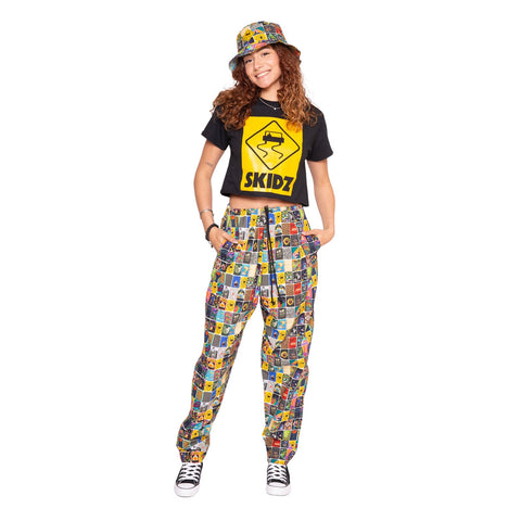 Lifestyle image of woman wearing the Zippo x SKIDZ Pants and the Zippo x SKIDZ Bucket Hat.