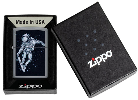 Zippo Skateboarding Astronaut Design Flat Grey Windproof Lighter in its packaging.