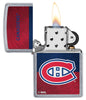 NHL® Montreal Canadiens Street Chrome™ Windproof Lighter with its lid open and lit