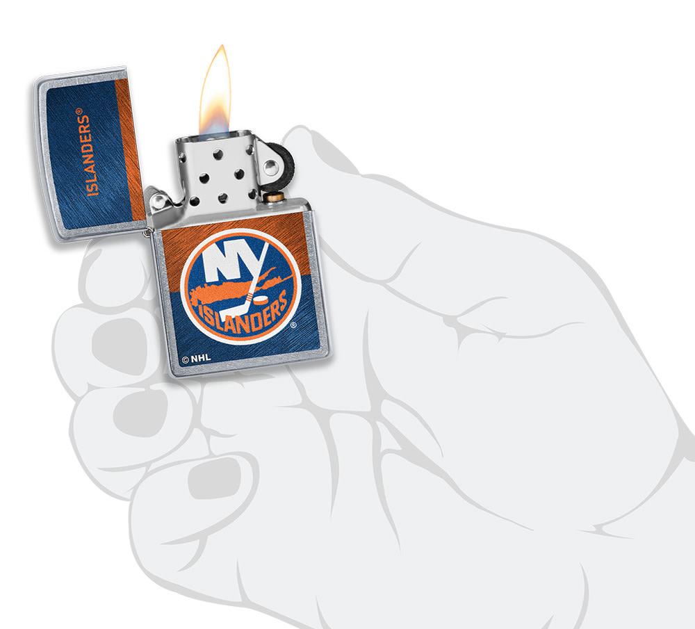 NHL® New York Islanders Street Chrome™ Windproof Lighter lit in hand