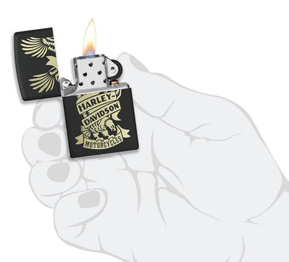 Harley-DavidsonÂ® Eagle Black Matte Windproof Lighter lit in hand.