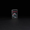 Lifestyle image of NFL Tampa Bay Buccaneers Helmet Street Chrome Windproof Lighter standing in a black background.