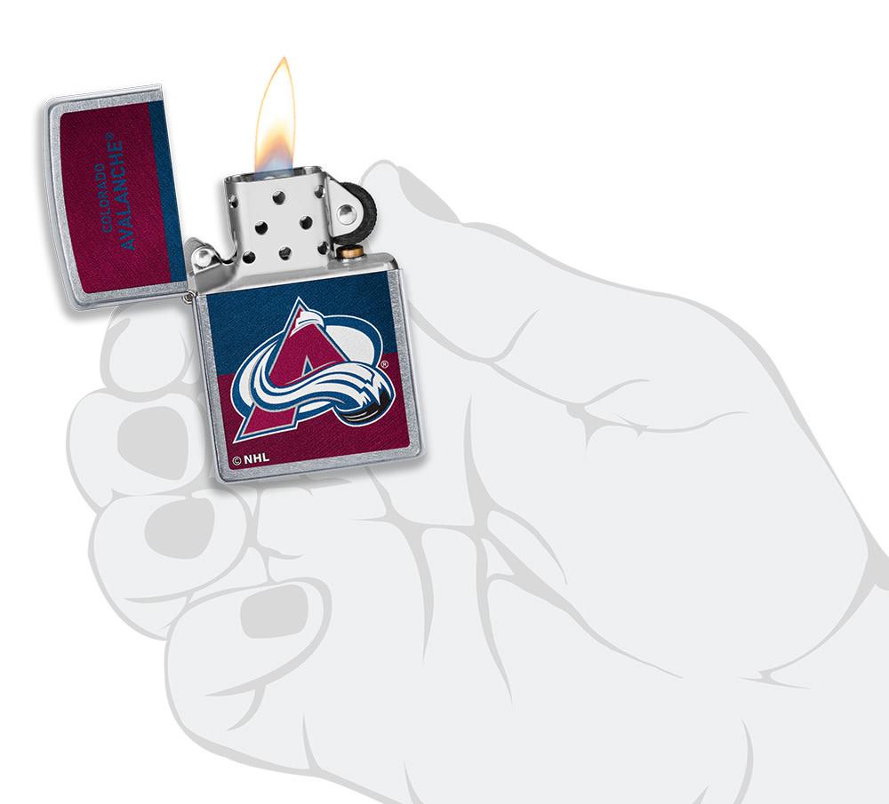 NHL® Colorado Avalanche Street Chrome™ Windproof Lighter lit in hand