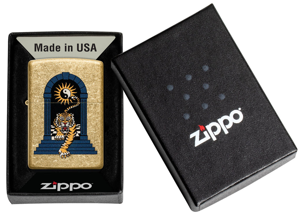 Zippo Tiger Tattoo Design Tumbled Brass Windproof Lighter in its packaging.