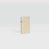 Lifestyle image of Slim® Flat Sand Windproof Lighter standing in a grey scene.