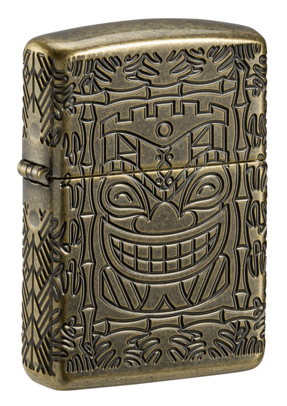 Front view of Tiki Design ArmorÂ® Antique Brass Windproof Lighter standing at a 3/4 angle.