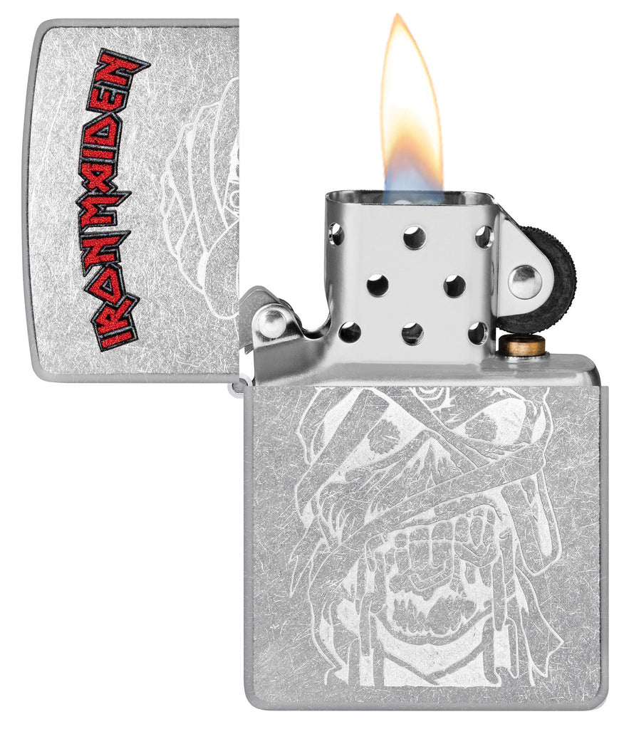 Zippo Iron Maiden Eddie Street Chrome Windproof Lighter with its lid open and lit.