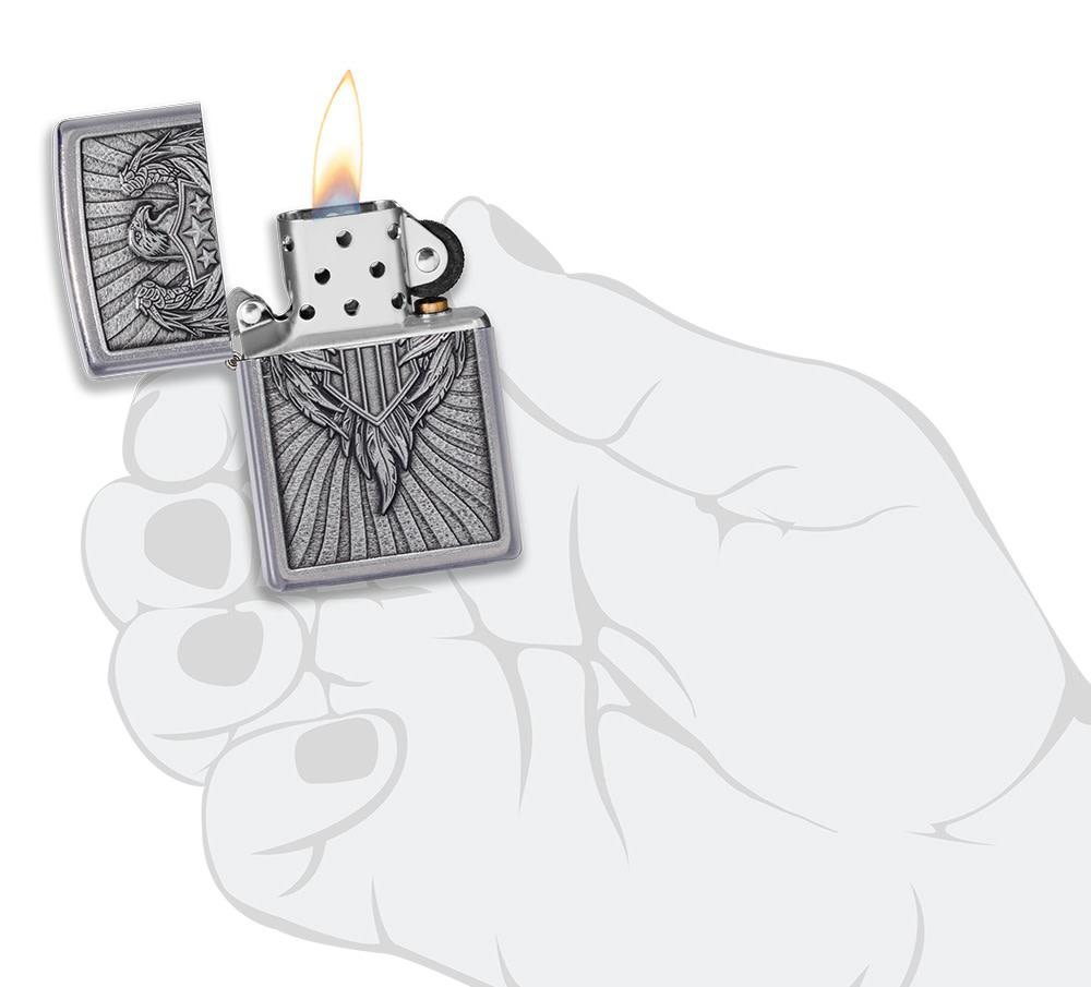 Eagle Shield Emblem Design Street Chromeâ„¢ Windproof Lighter lit in hand