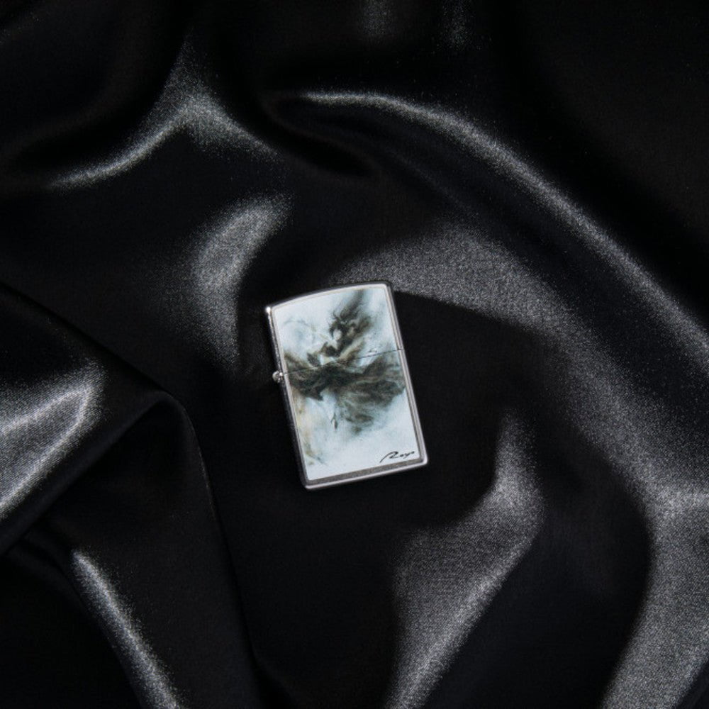 Lifestyle image of Luis Royo Design Street Chromeâ„¢ Windproof Lighter laying on a black cloth.