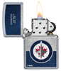 NHL® Winnipeg Jets Street Chrome™ Windproof Lighter with its lid open and lit