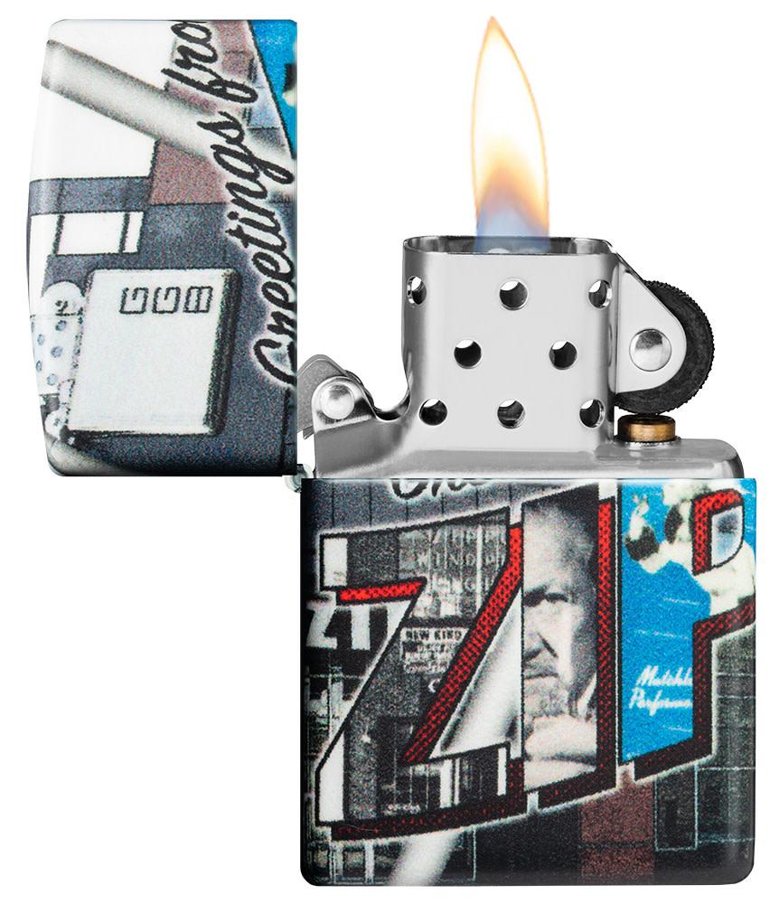 Greetings from Zippo 540 Color Windproof Lighter with its lid open and lit