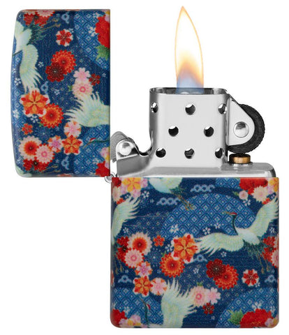 Kimono Design 540 Color Windproof Lighter with its lid open and lit.