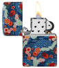 Kimono Design 540 Color Windproof Lighter with its lid open and lit.