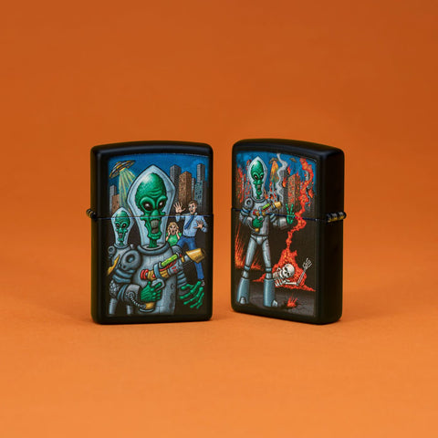 Lifestyle image of two Zippo Alien Attack Design Black Matte Pocket Lighters standing in an orange scene.