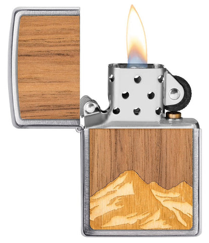 WOODCHUCK USA Mountains Brushed Chrome Windproof Lighter with its lid open and lit.