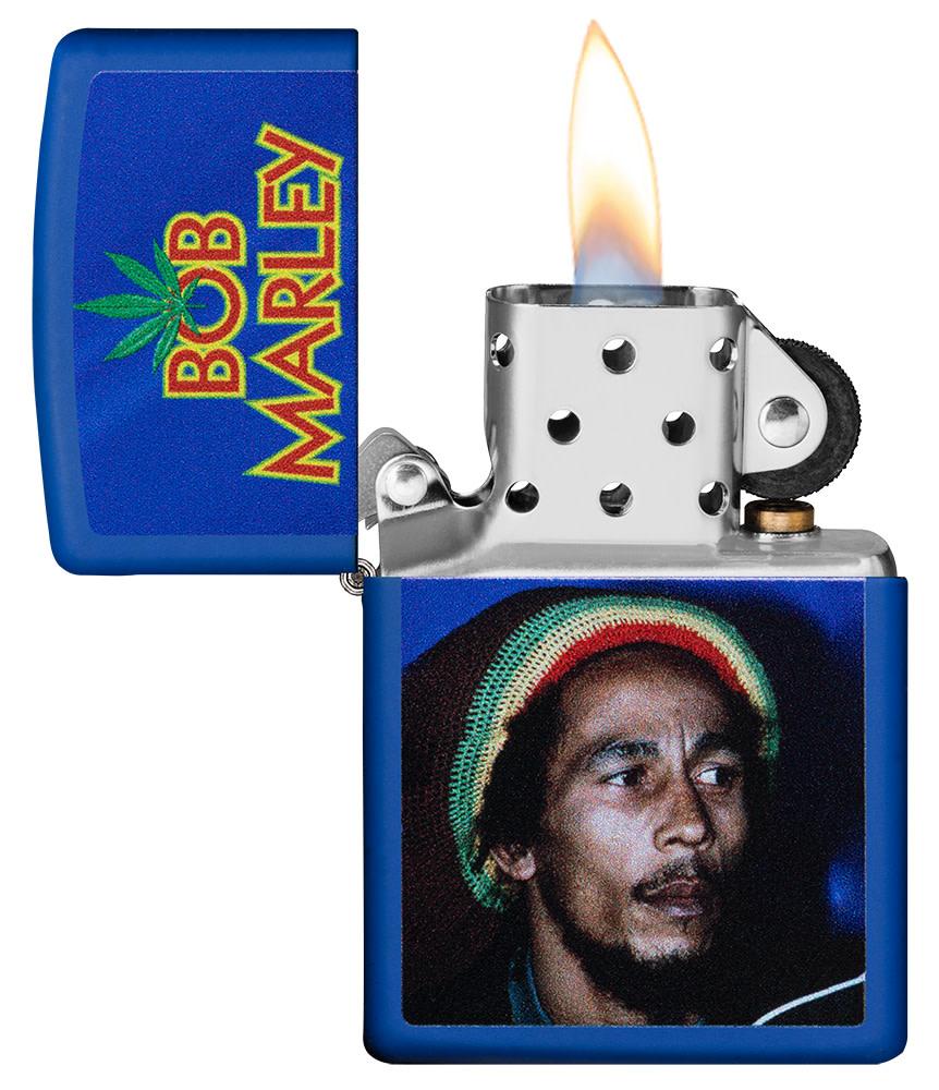 Bob Marley Royal Blue Matte Windproof Lighter with its lid open and lit
