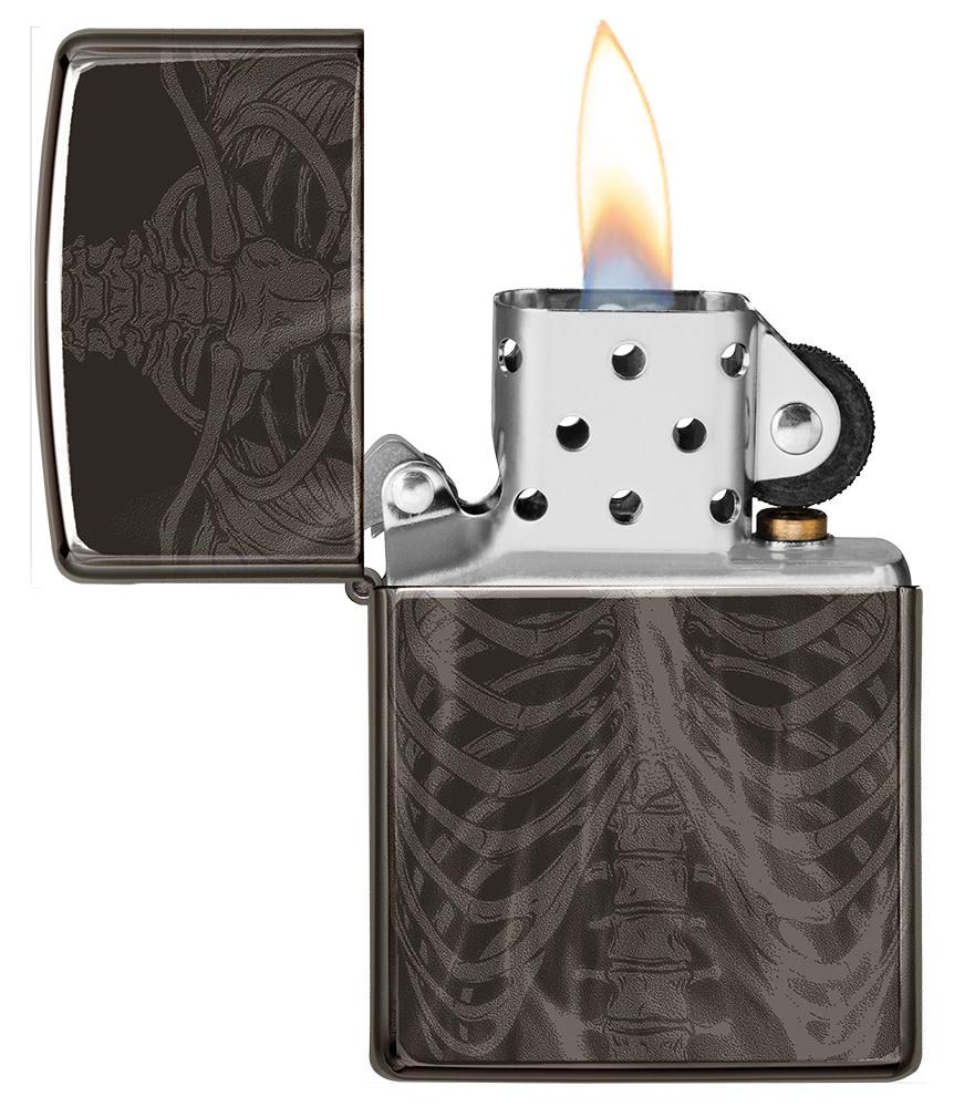 Rib Cage Design High Polish Black Windproof Lighter with its lid open and lit.