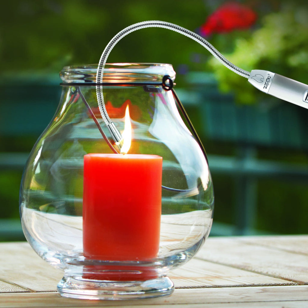 Lifestyle image of Flex Neck XL Utility Lighter lighting a candle inside a glass container