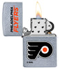 NHL Philadelphia Flyers Street Chrome™ Windproof Lighter with its lid open and lit
