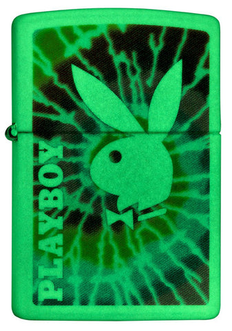 Front shot of Playboy Tie-Dye Glow In the Dark Windproof Lighter glowing in the dark. 