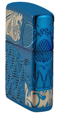Skull Design Armor® High Polish Blue Windproof Lighter standing at an angle, showing the front and right side of the lighter.