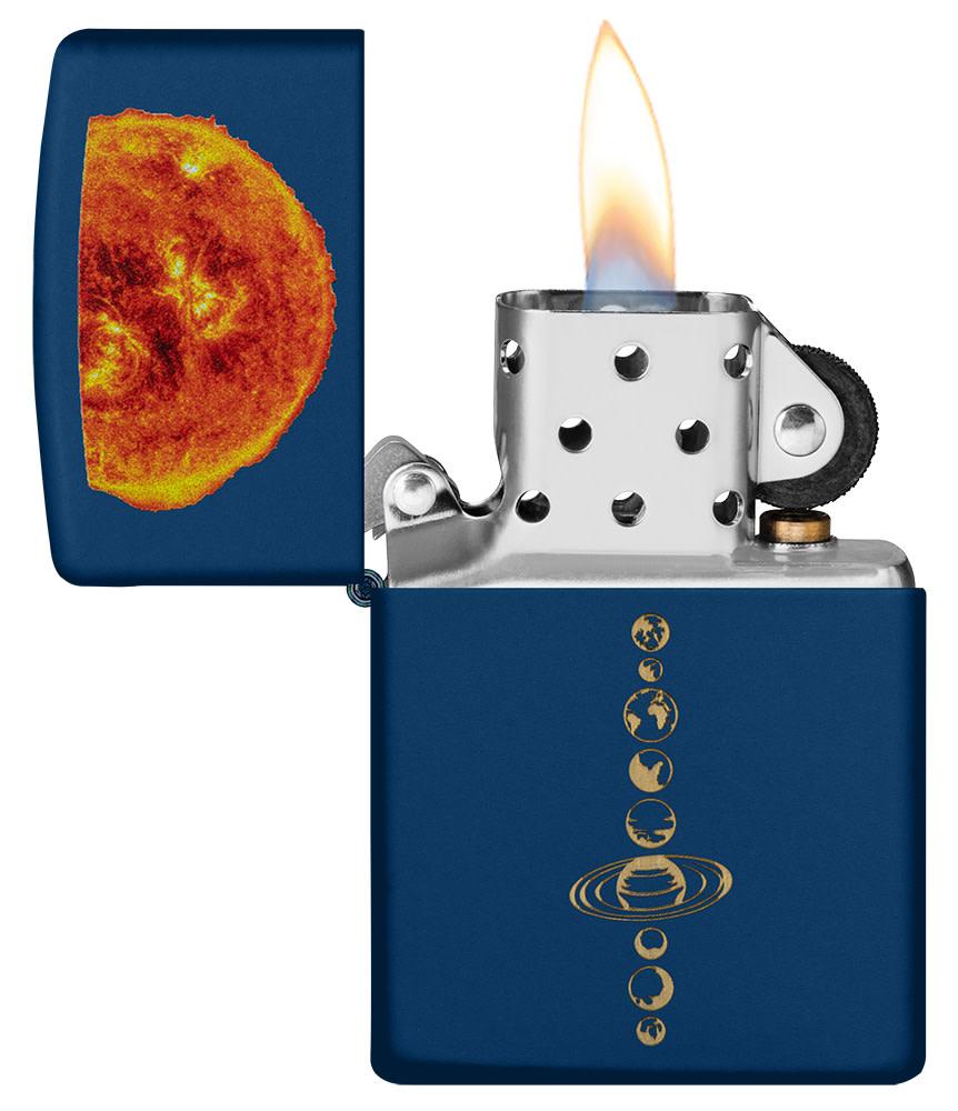Solar System Design Navy Matte Windproof Lighter with its lid open and lit.