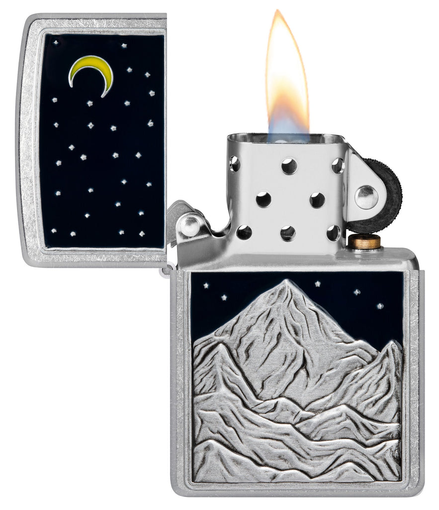 Zippo Mountain Emblem Street Chrome Windproof Lighter with its lid open and lit.