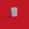Glamour shot of Zippo Guy Harvey Shark Design Street Chomre Windproof Lighter standing in a red scene.