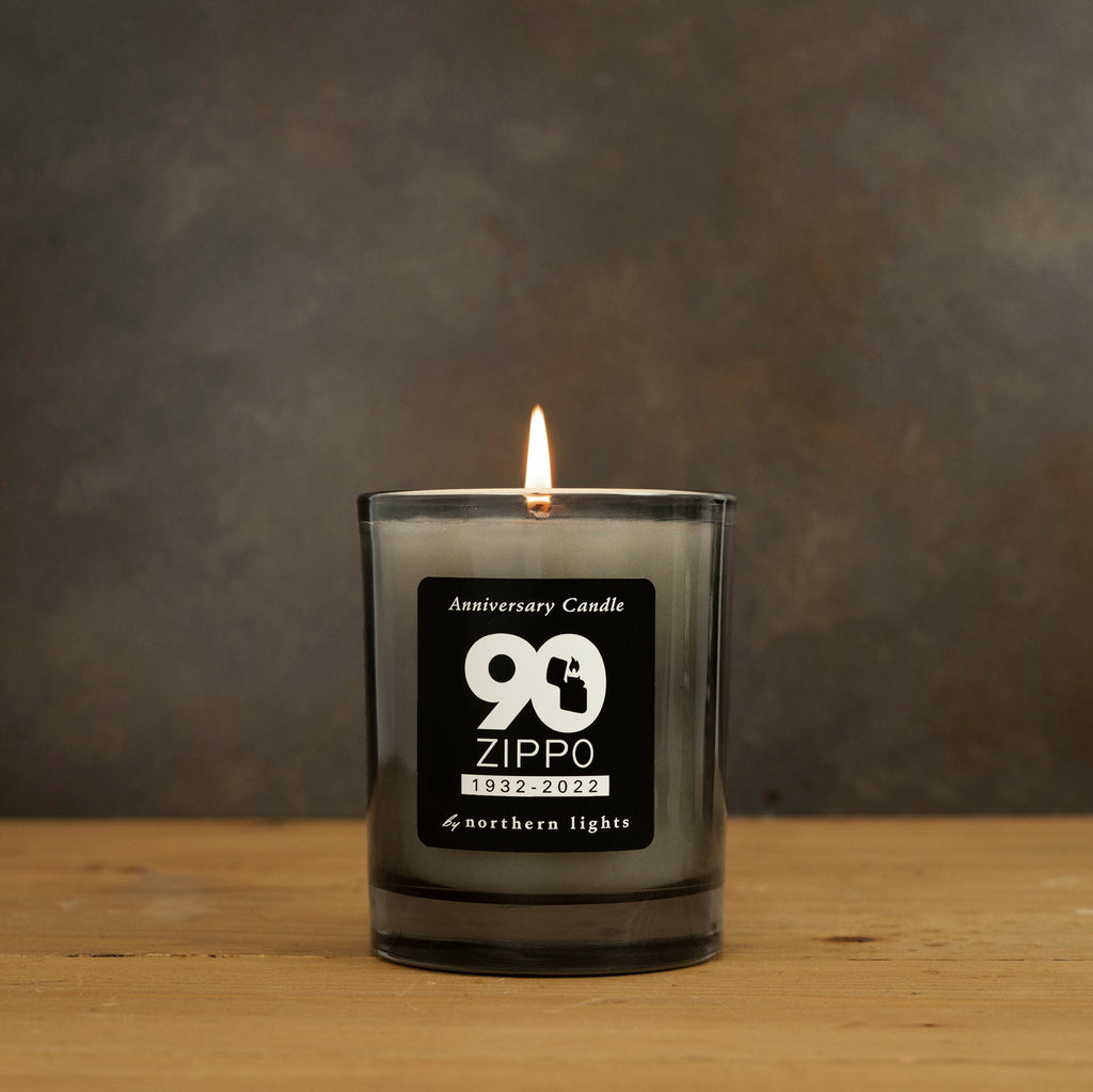 Lifestyle image of Zippo 90th Anniversary Water Chestnut Candle, with its wick lit.