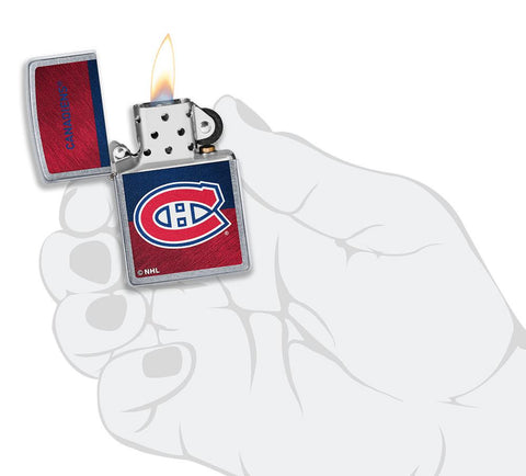 NHL® Montreal Canadiens Street Chrome™ Windproof Lighter lit in hand