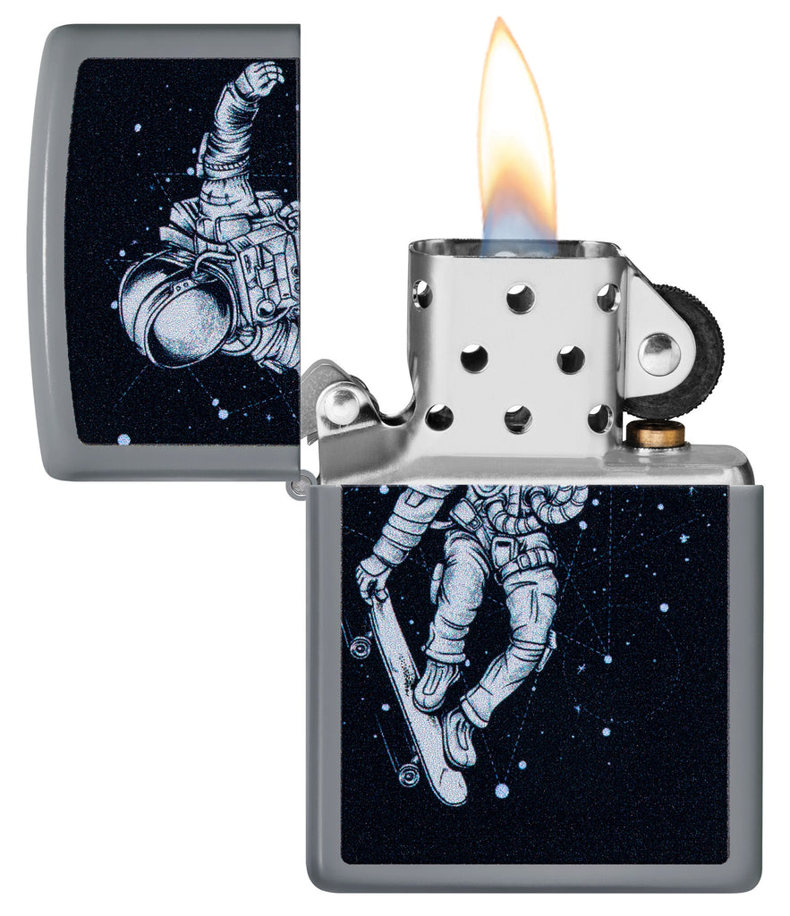 Zippo Skateboarding Astronaut Design Flat Grey Windproof Lighter with its lid open and lit.