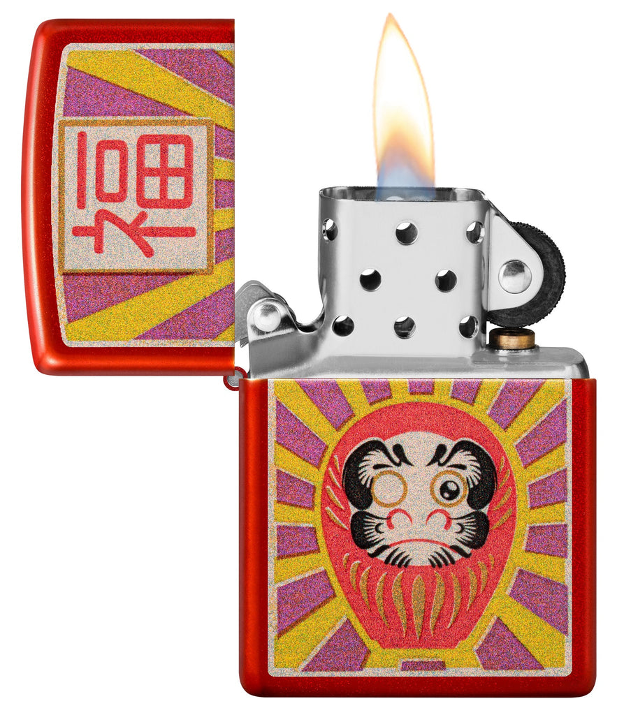 Zippo Daruma Design Metallic Red Windproof Lighter with its lid open and lit.