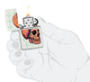 Zippo Cyber Skull Design White Matte Windproof Lighter lit in hand.