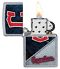 MLB™ Cleveland Guardians™ Street Chrome™ Windproof Lighter with its lid open and lit.