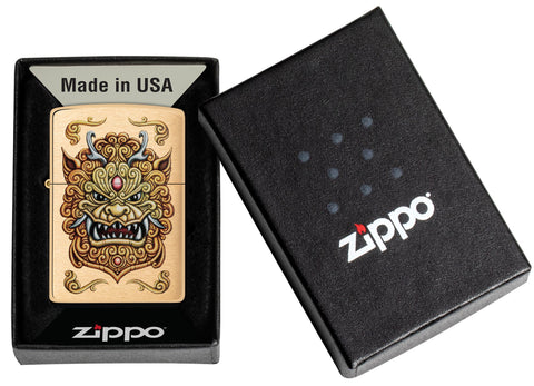 Zippo Foo Dog Design Brushed Brass Windproof Lighter in its packaging.