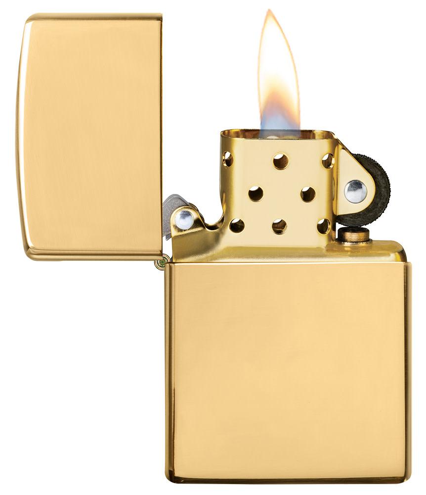 ArmorÂ® High Polish 18K Solid Gold Windproof Lighter with its lid open and lit.