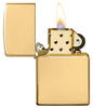 Armor® High Polish 18K Solid Gold Windproof Lighter with its lid open and lit.