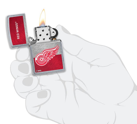 NHL® Detroit Red Wings Street Chrome™ Windproof Lighter lit in hand