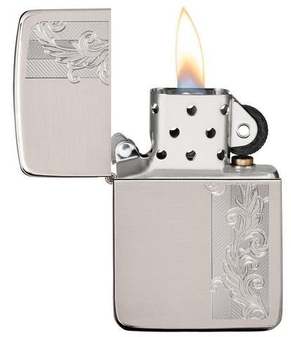 1941 Replica Sterling Silver Herringbone Filigree Design Windproof Lighter with its lid open and lit.
